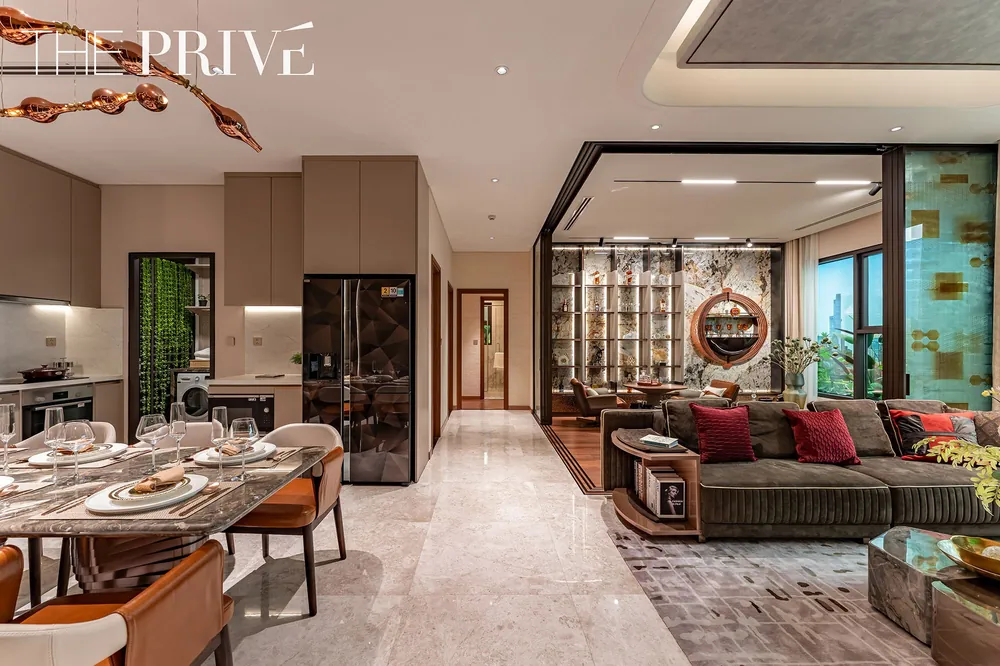 Kitchen, dining and living areas in The Privé show apartment